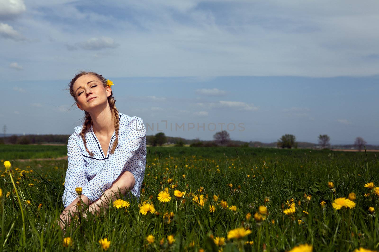 smiling woman outdoor in summer with flowers