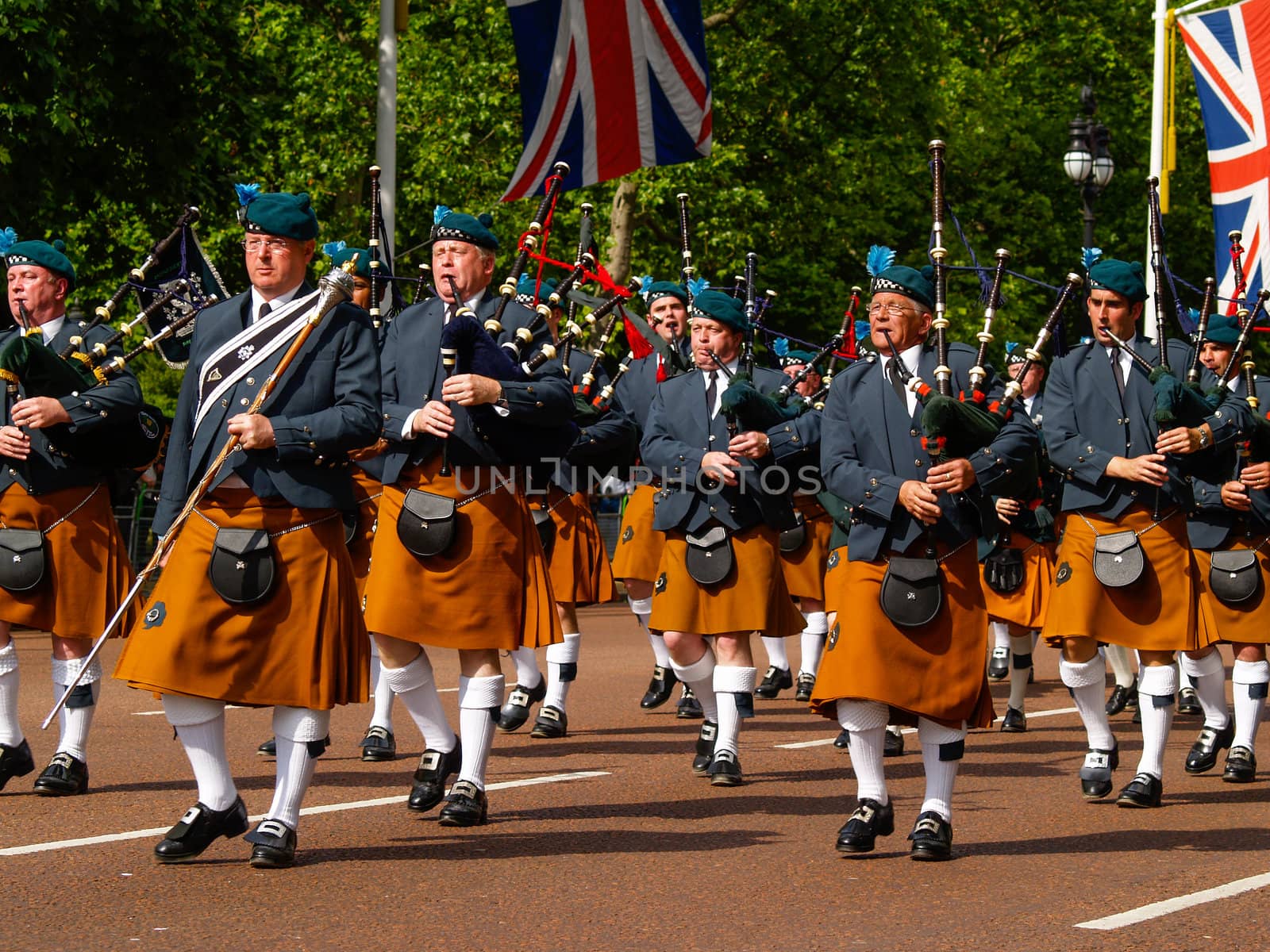 Bagpipers marching along Londons mall towards Buchingham Palace.