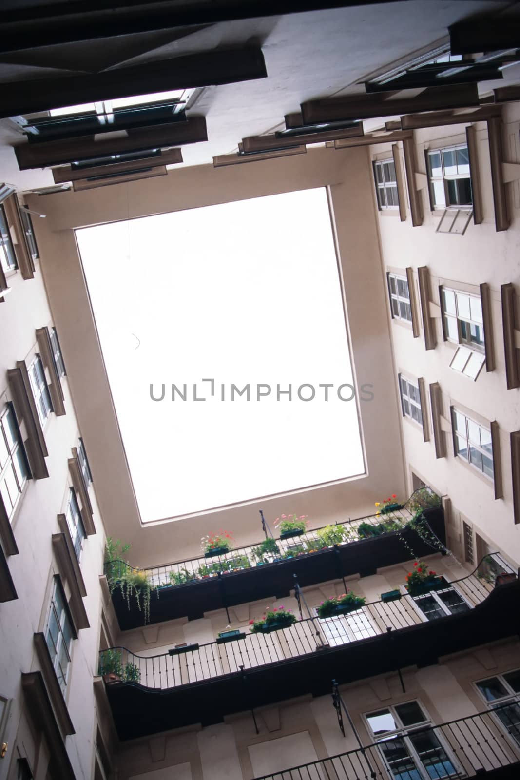 Looking upward from a central courtyard by PiLens