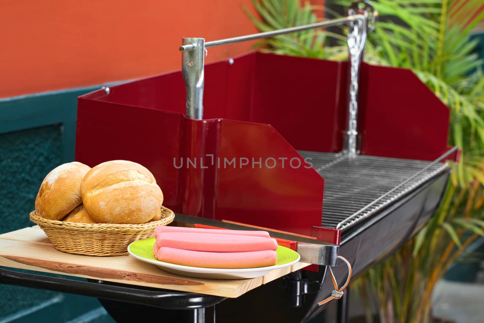 Preparing a barbecue with sausages (Selective Focus, Focus on the sausages)