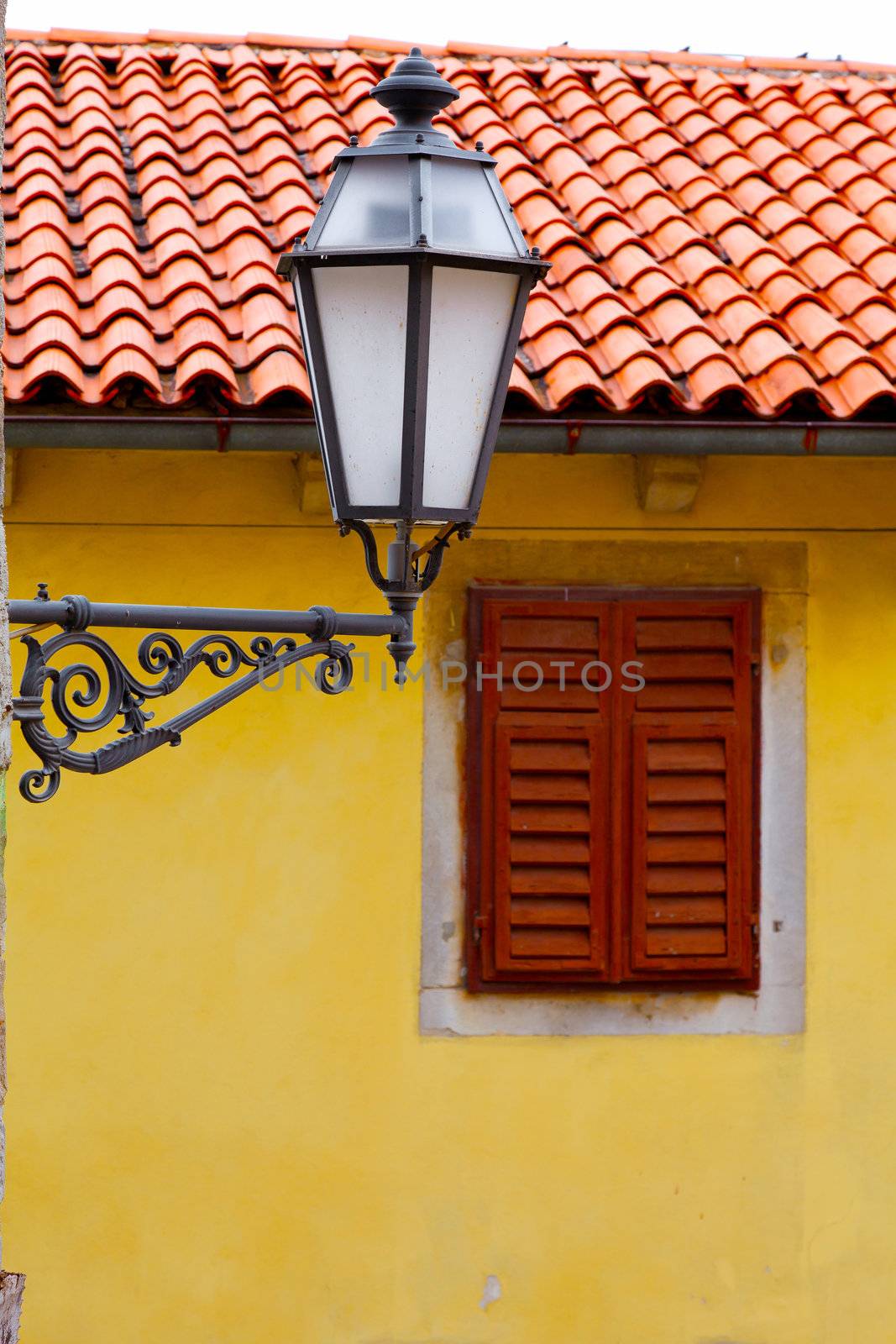 old street-lamp on house window