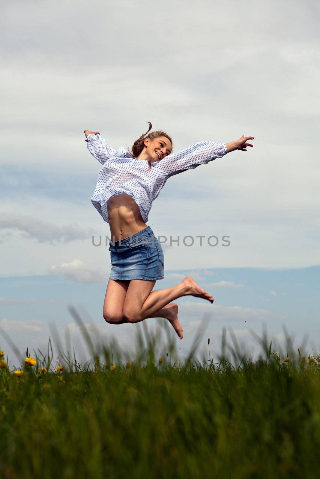 young woman is happy outdoor in summer