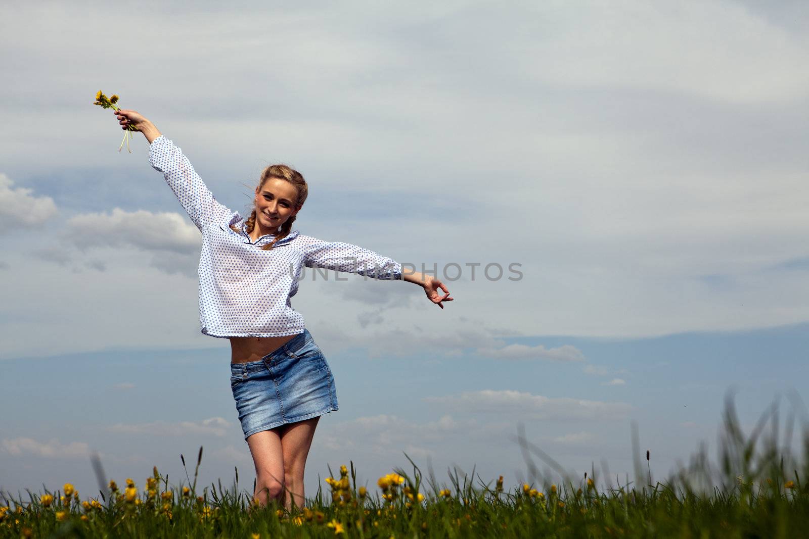 young woman is happy outdoor in summer