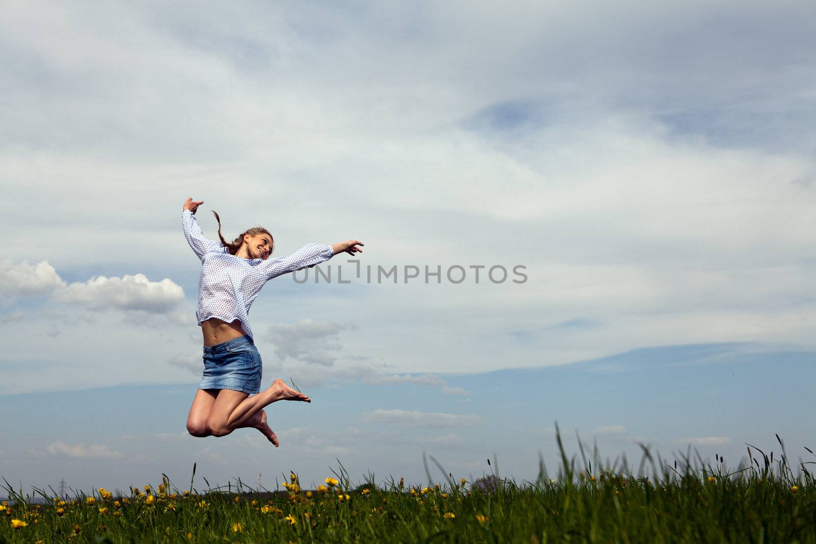 young woman is happy outdoor in summer by juniart