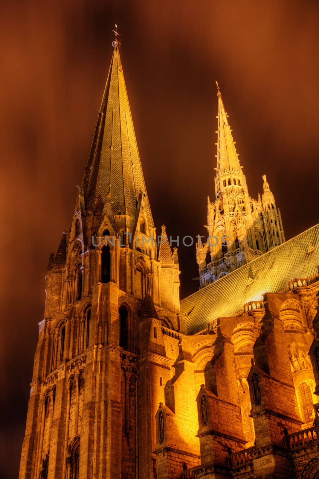 Details of the towers of the Cathedral in Chartres during a night illumination.