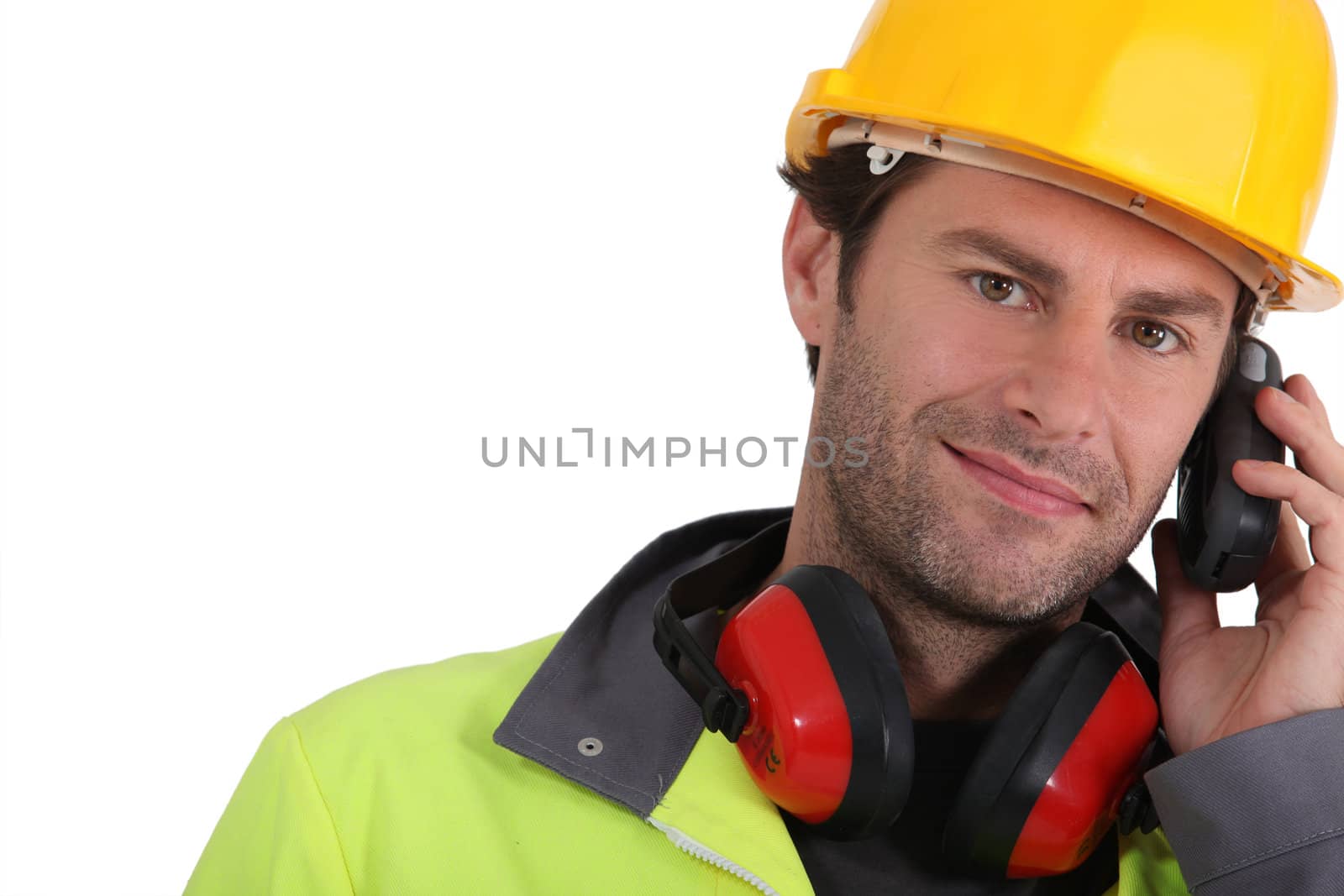 Construction worker holding radio receiver by phovoir