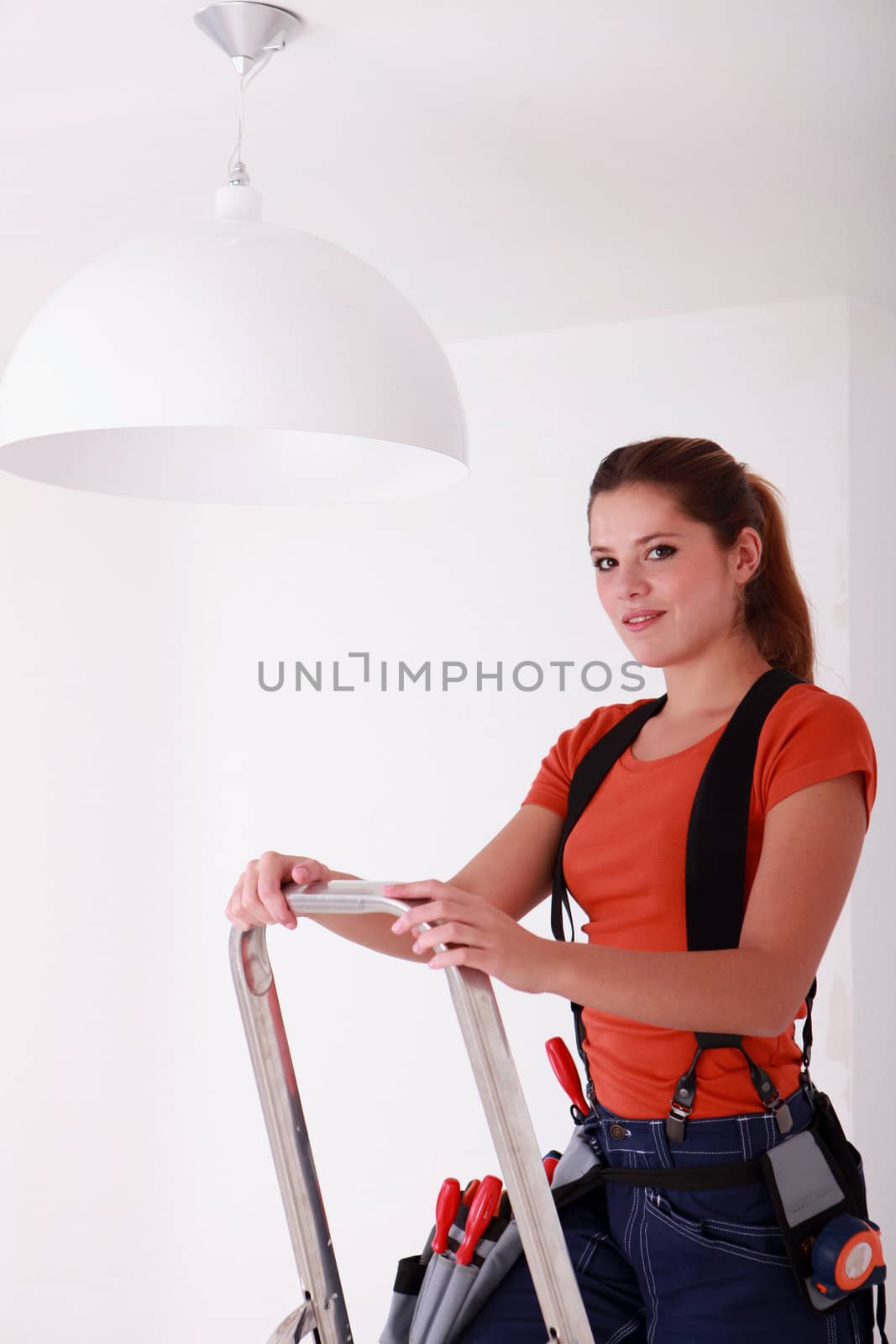 Woman on a stepladder