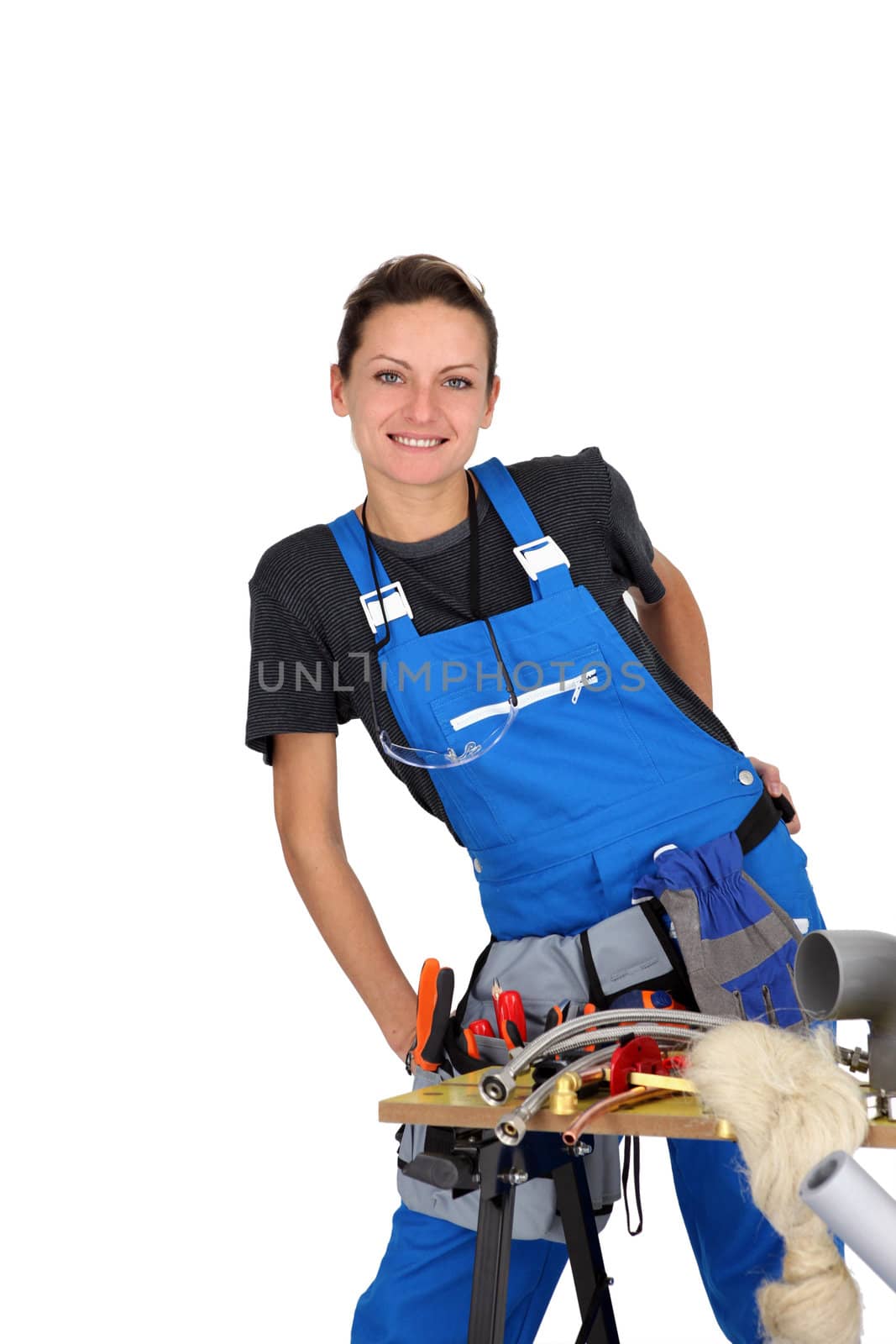 woman plumber behind table