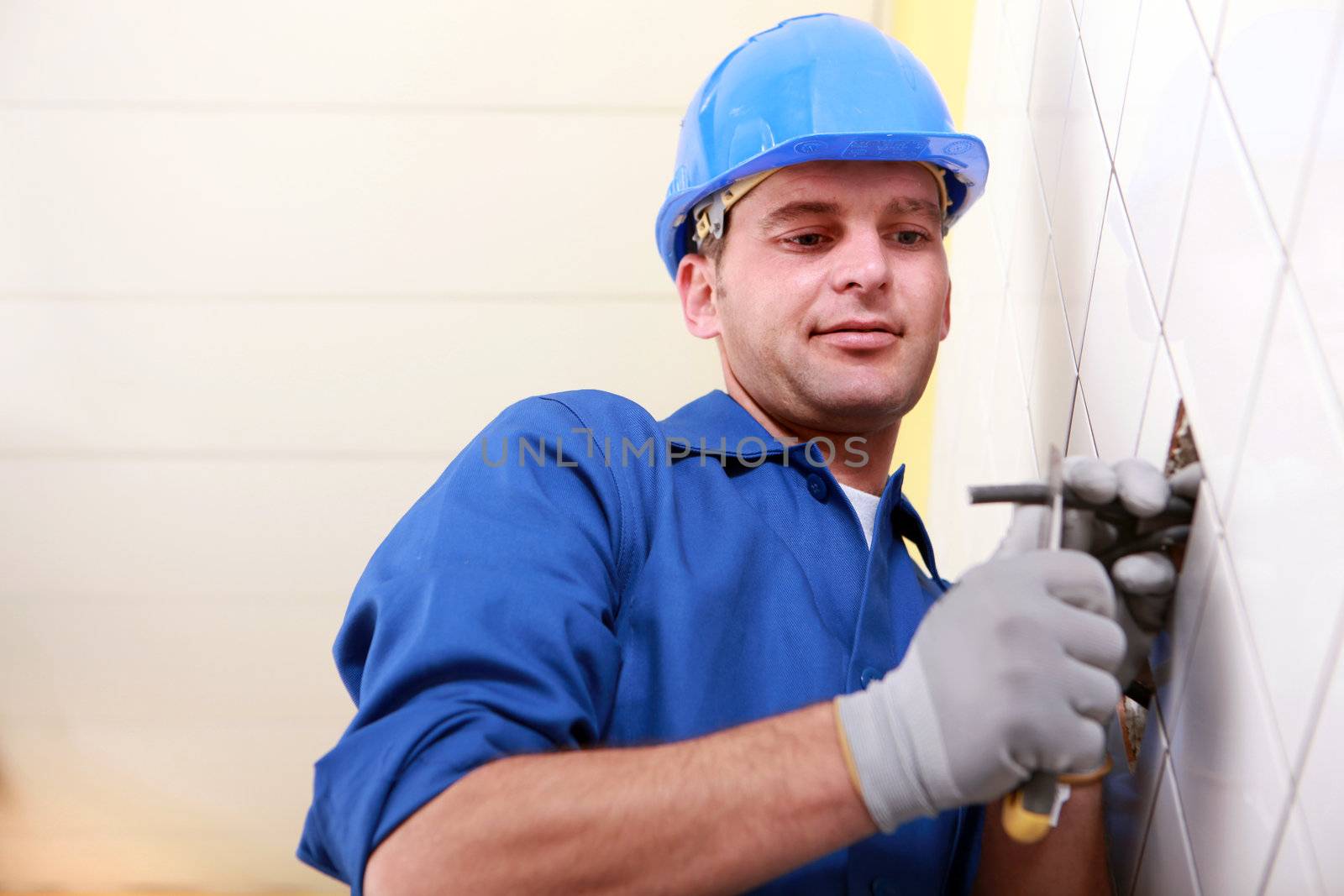 Worker cutting a wire