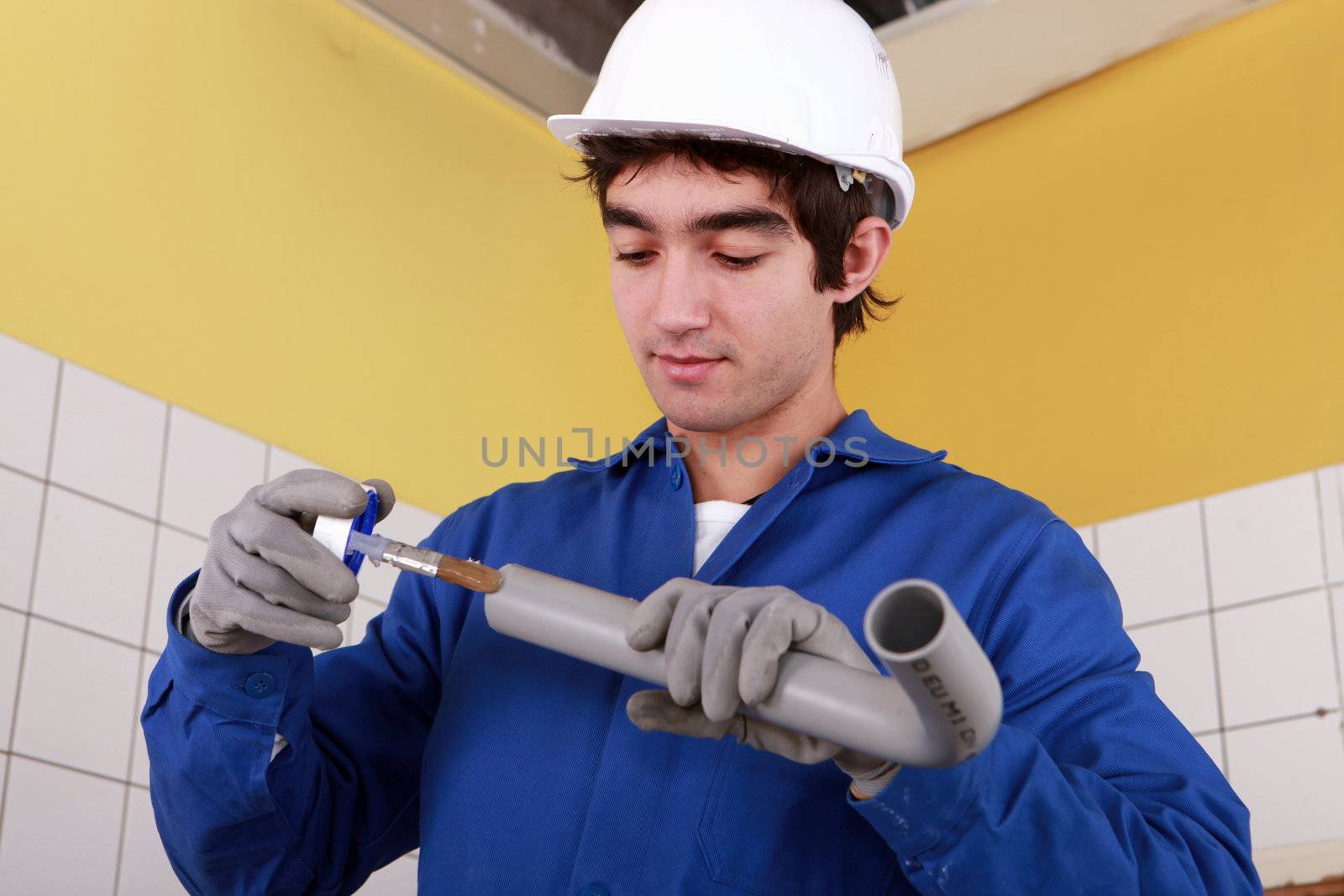 portrait of a young plumber