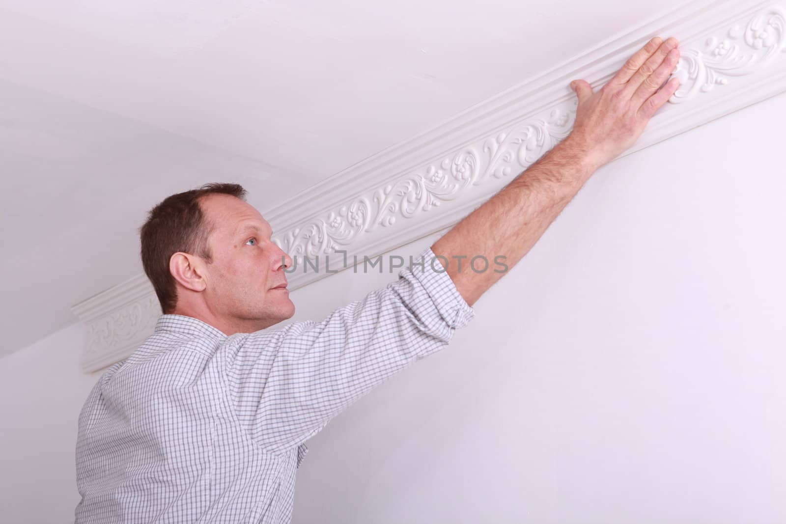 portrait of a man laying a frieze