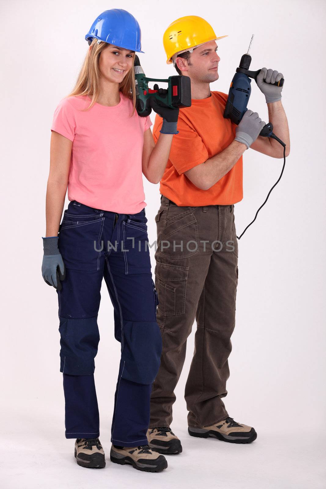 Man and woman with drills by phovoir