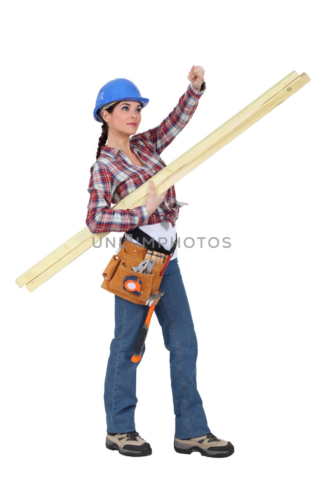 craftswoman carrying wooden boards