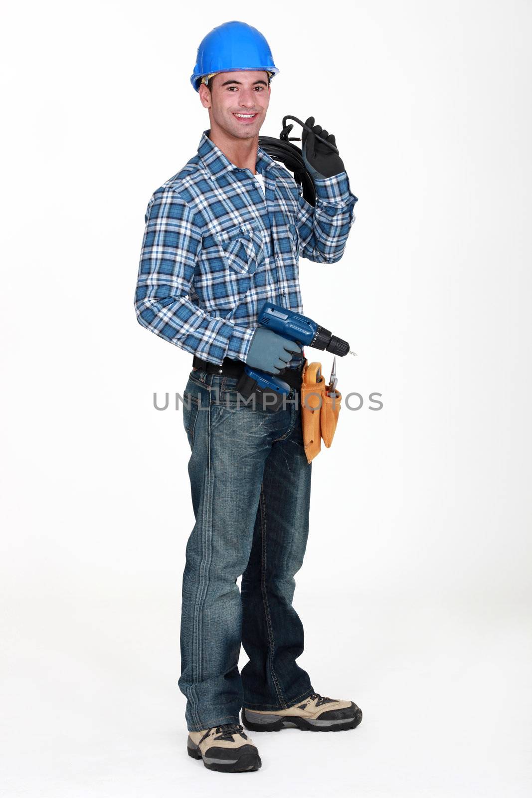 A man holding a driller.