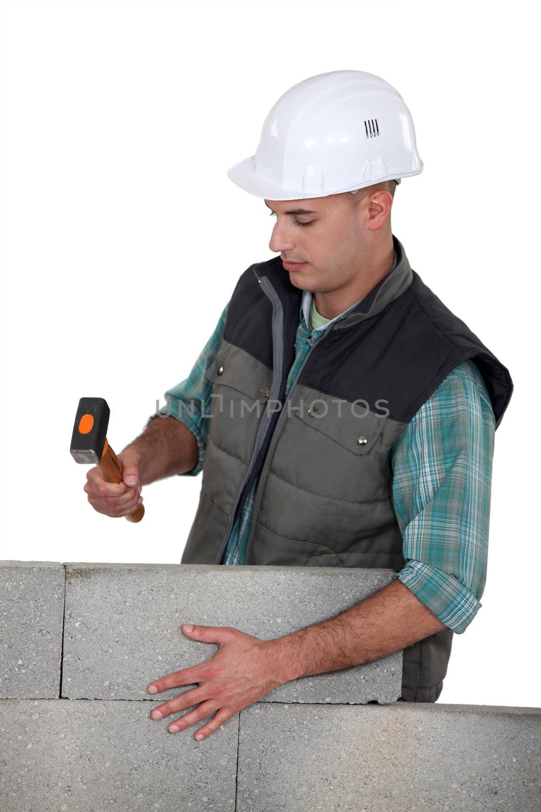 Stonemason holding a mallet