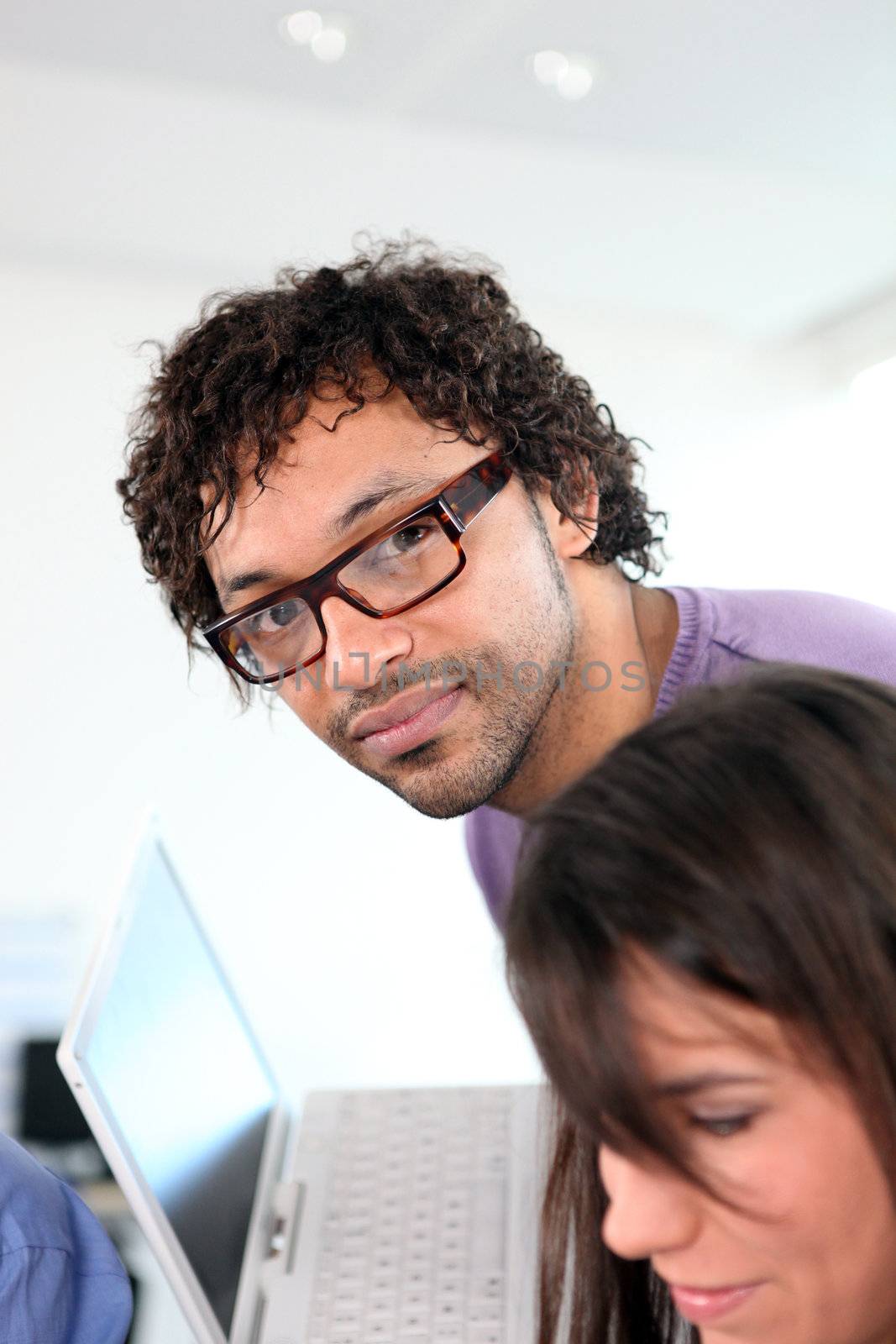 Office colleagues with a laptop