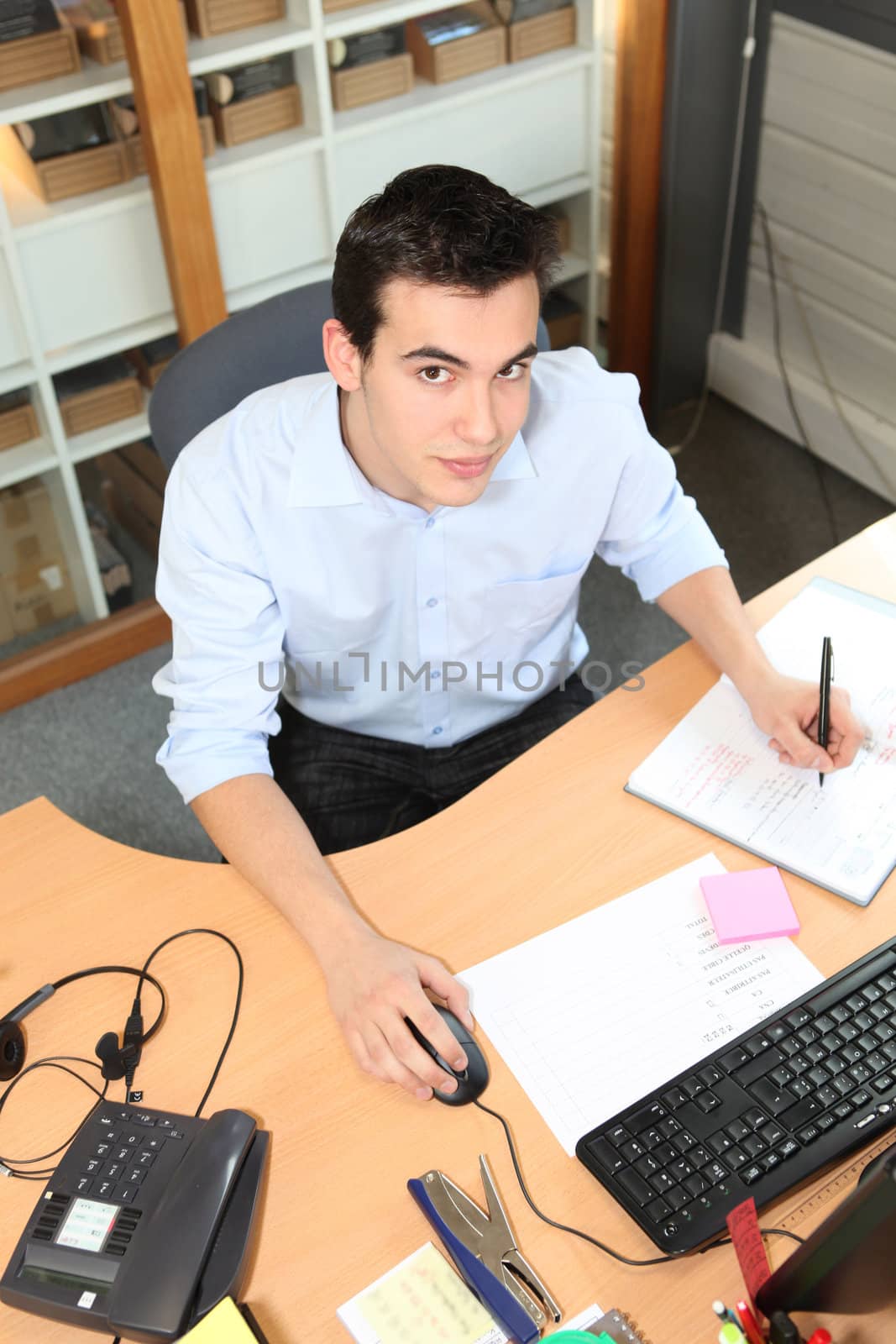 Young man working at an office desk