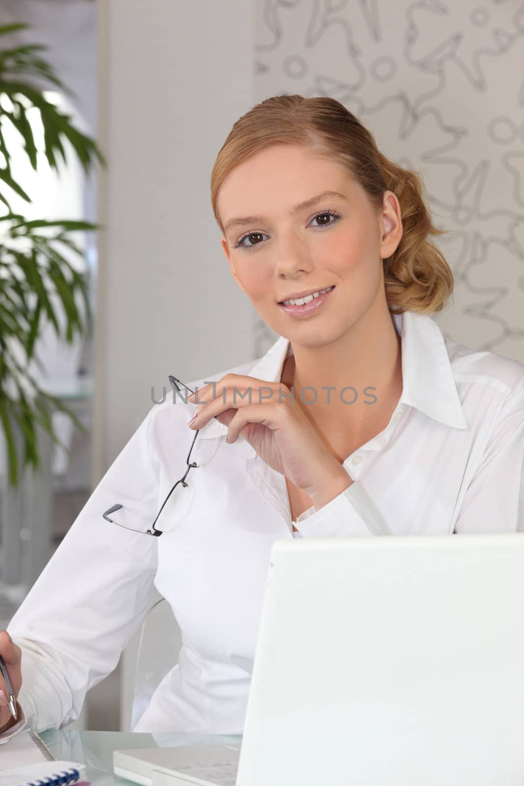 Confident woman sitting at a desk