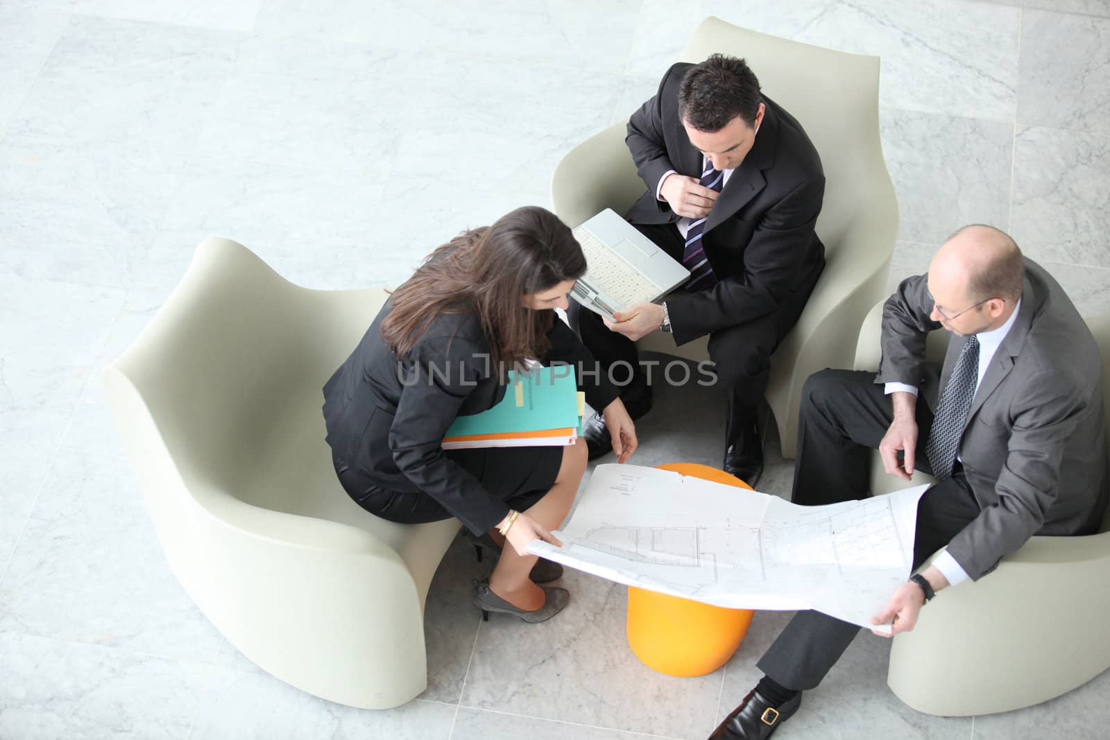 Businesspeople having a meeting, top view by phovoir
