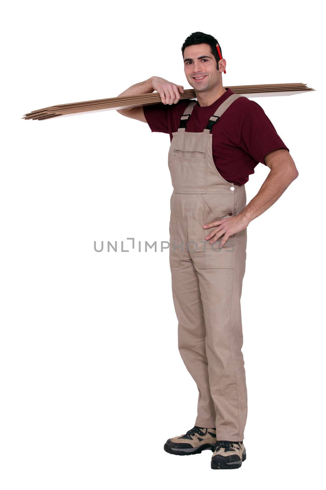 Happy woodworker standing on white background