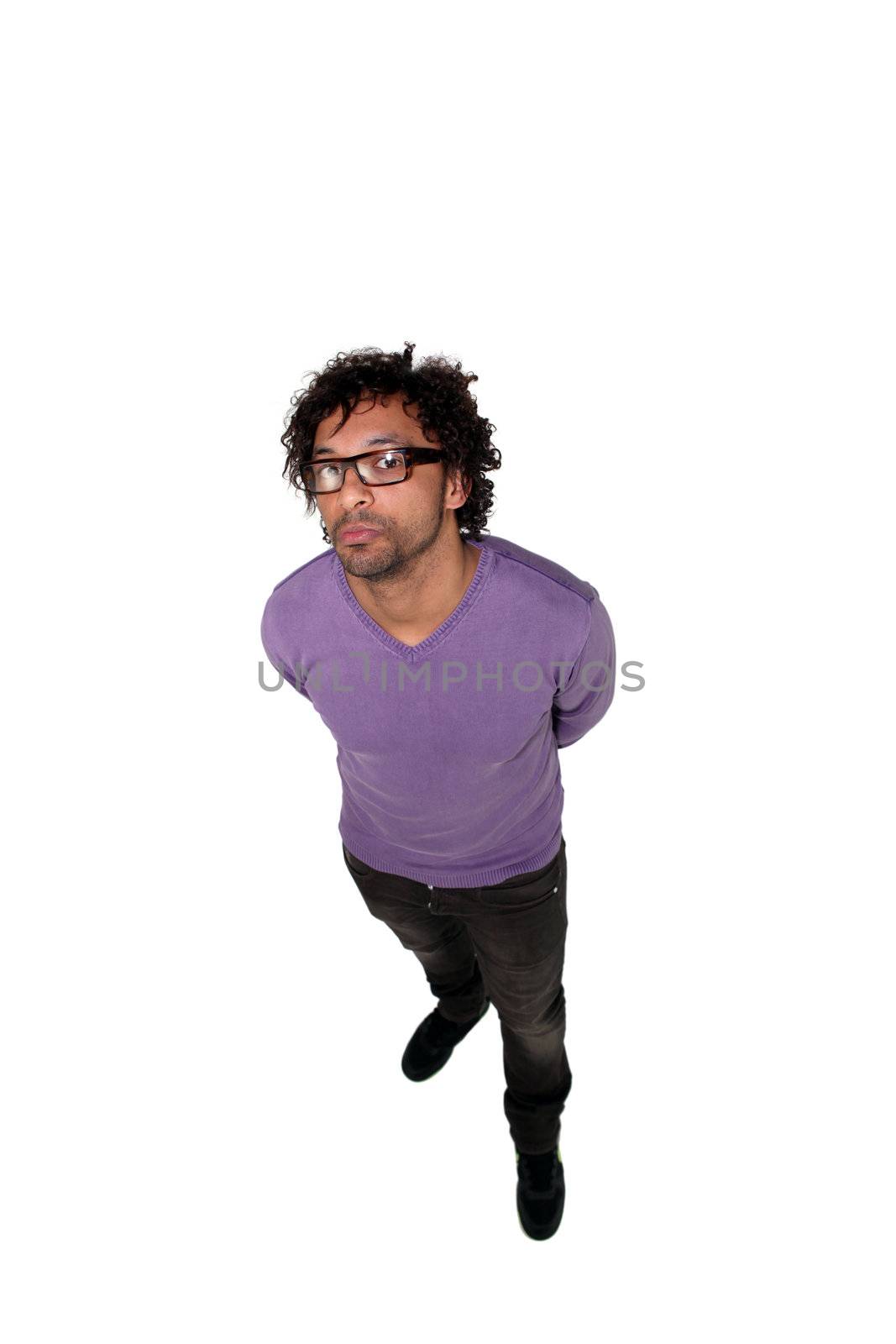 Full length studio shot of a man in glasses taken from above