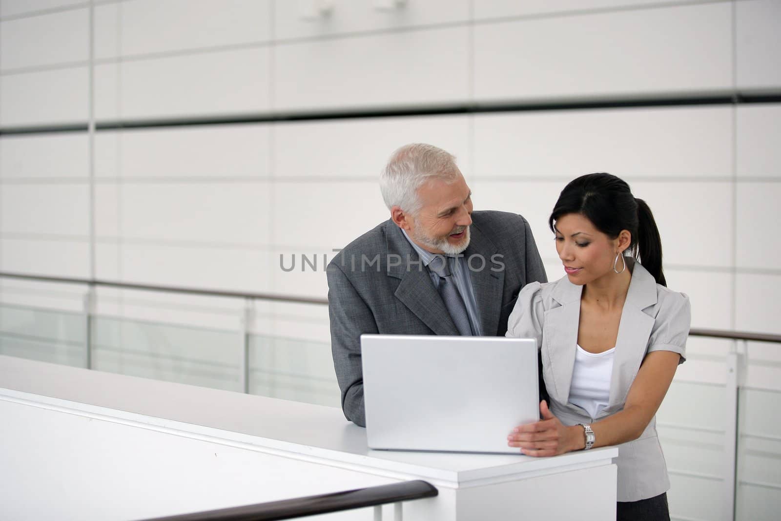 Businesspeople using a laptop
