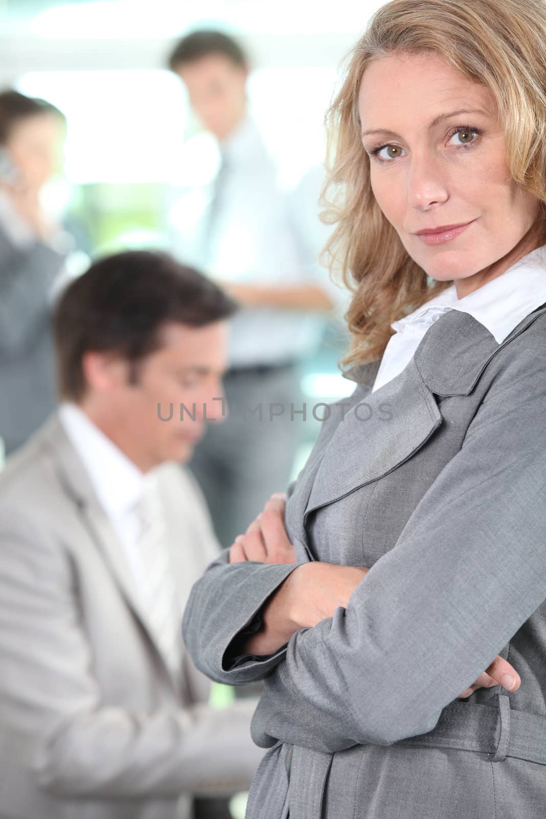 Businesswoman standing arms-crossed