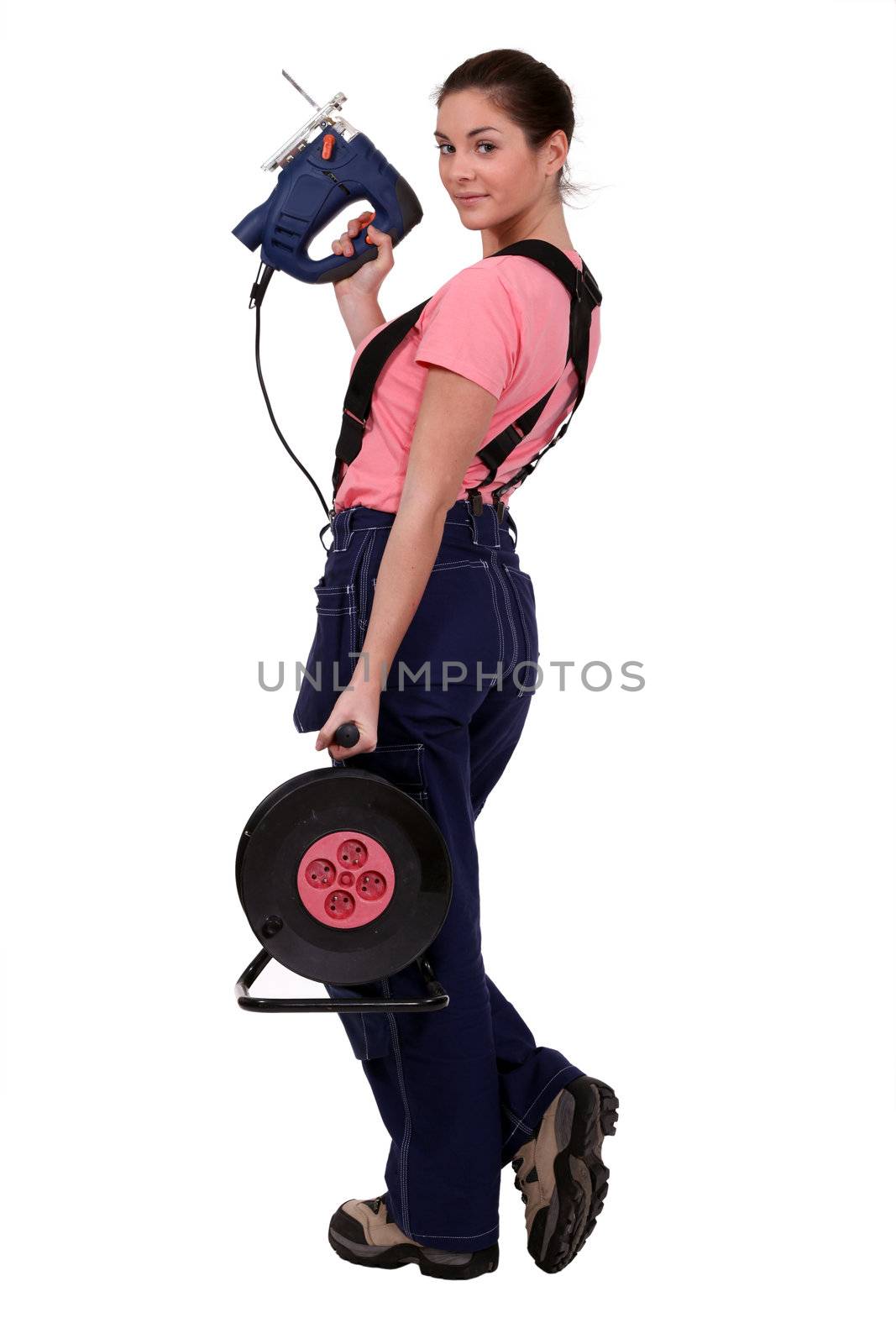 Woman with an electric saw