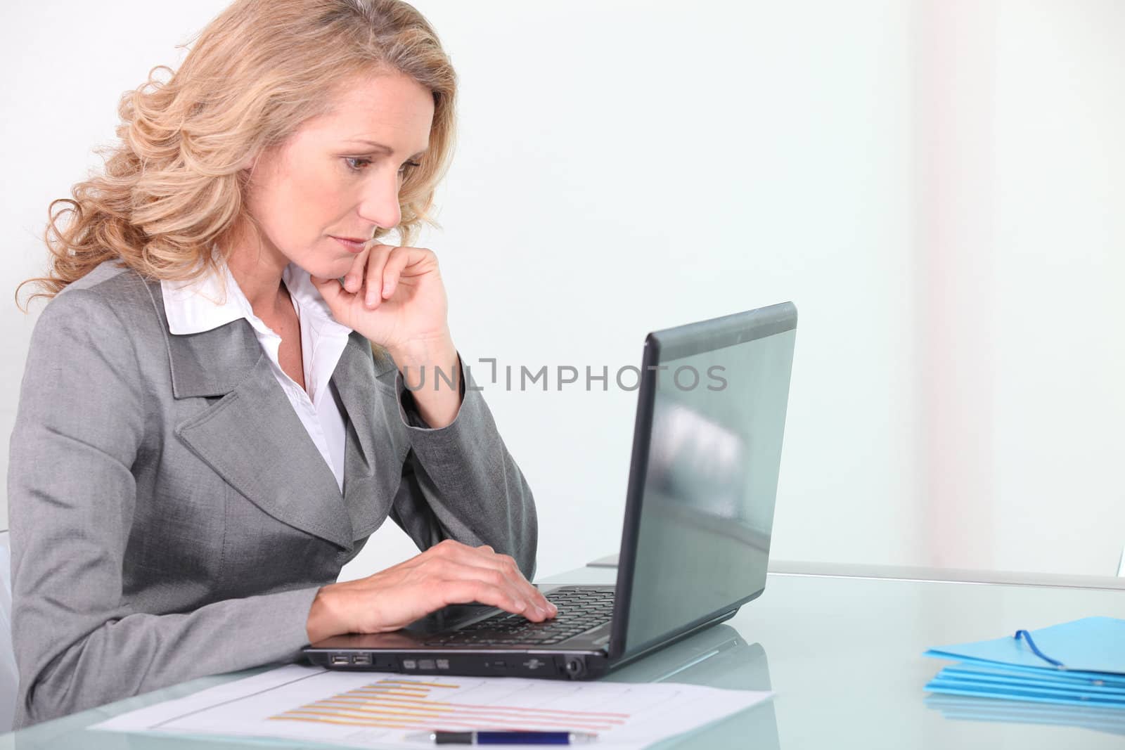 Businesswoman working on laptop