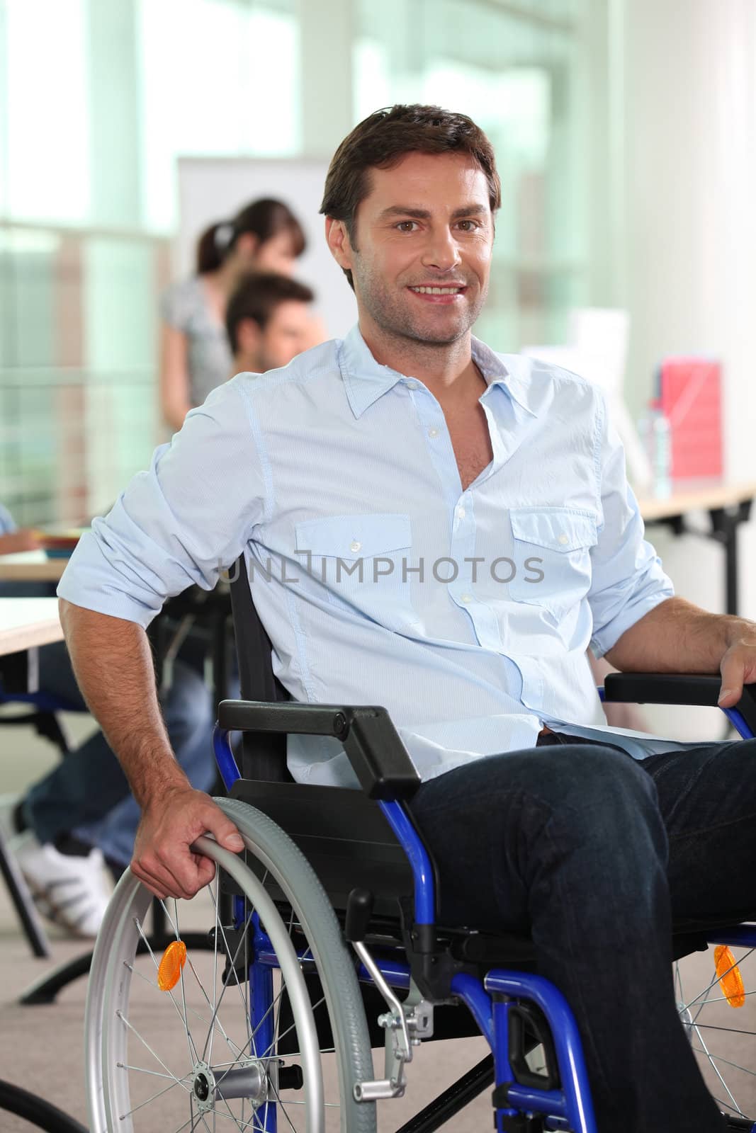 Businessman in a wheelchair by phovoir