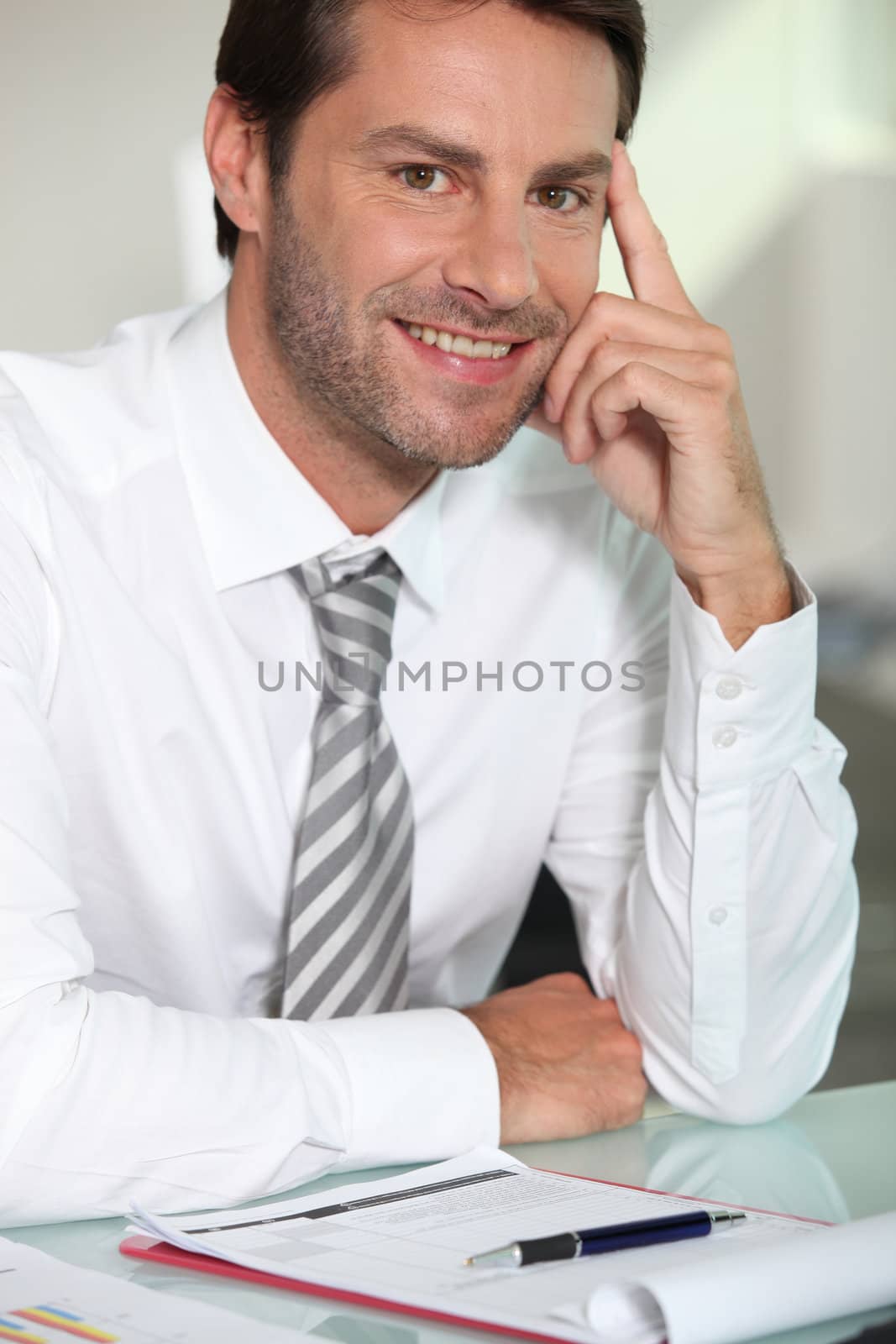 Businessman sat at desk