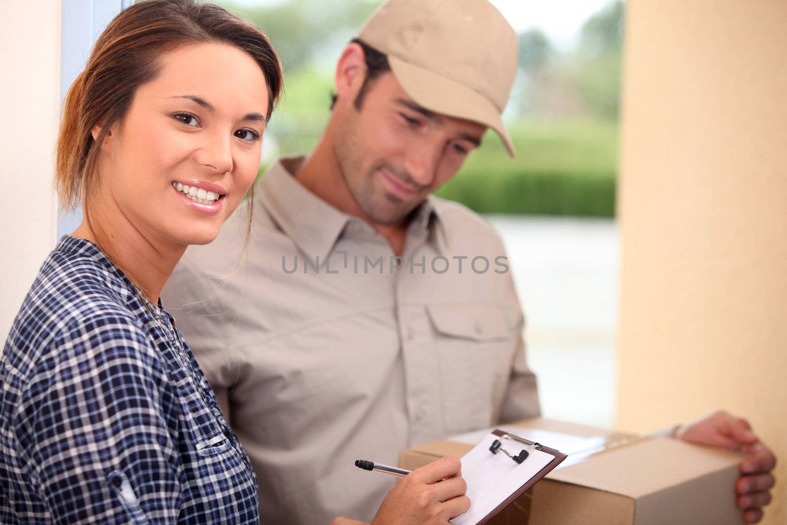 Woman signing for a package