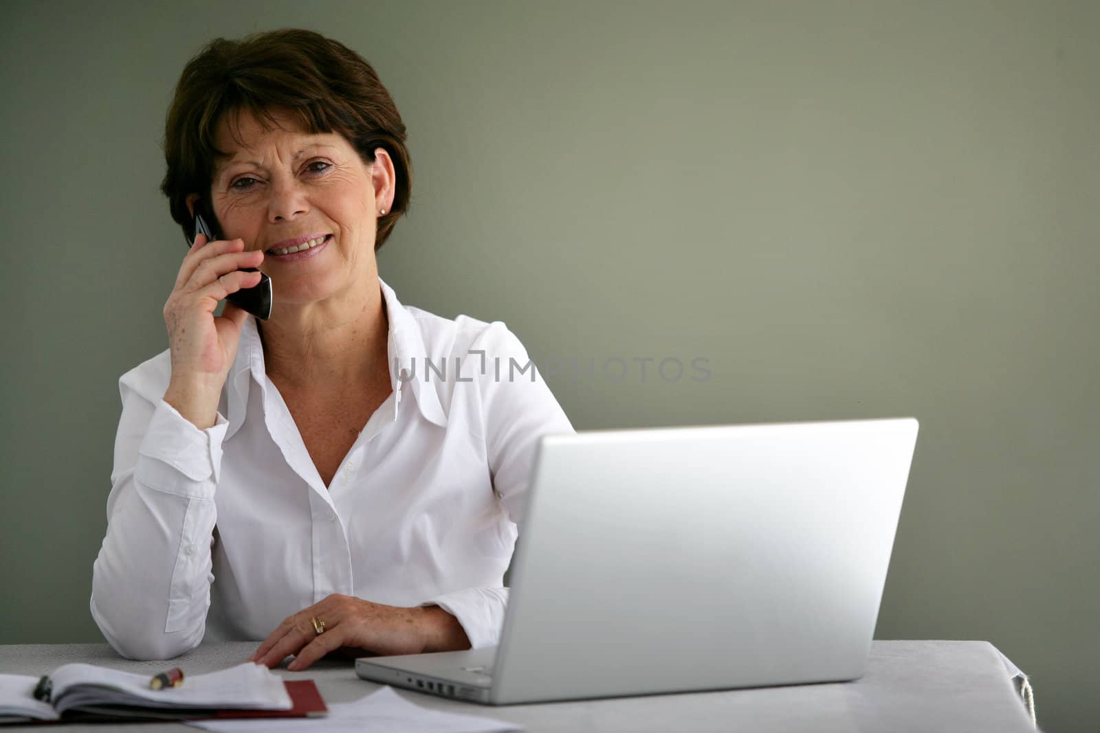 Middle-aged office worker at her desk