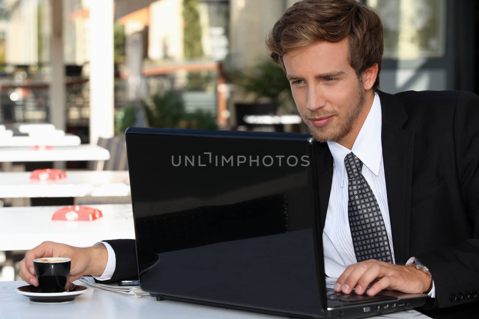 Businessman with a coffee and a computer