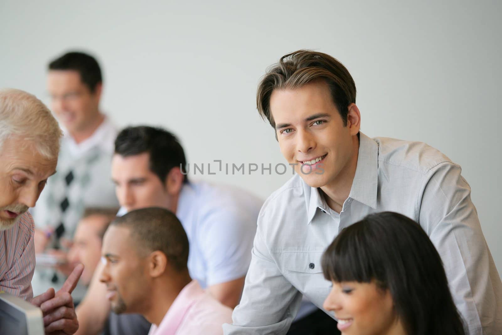 Man in business meeting by phovoir