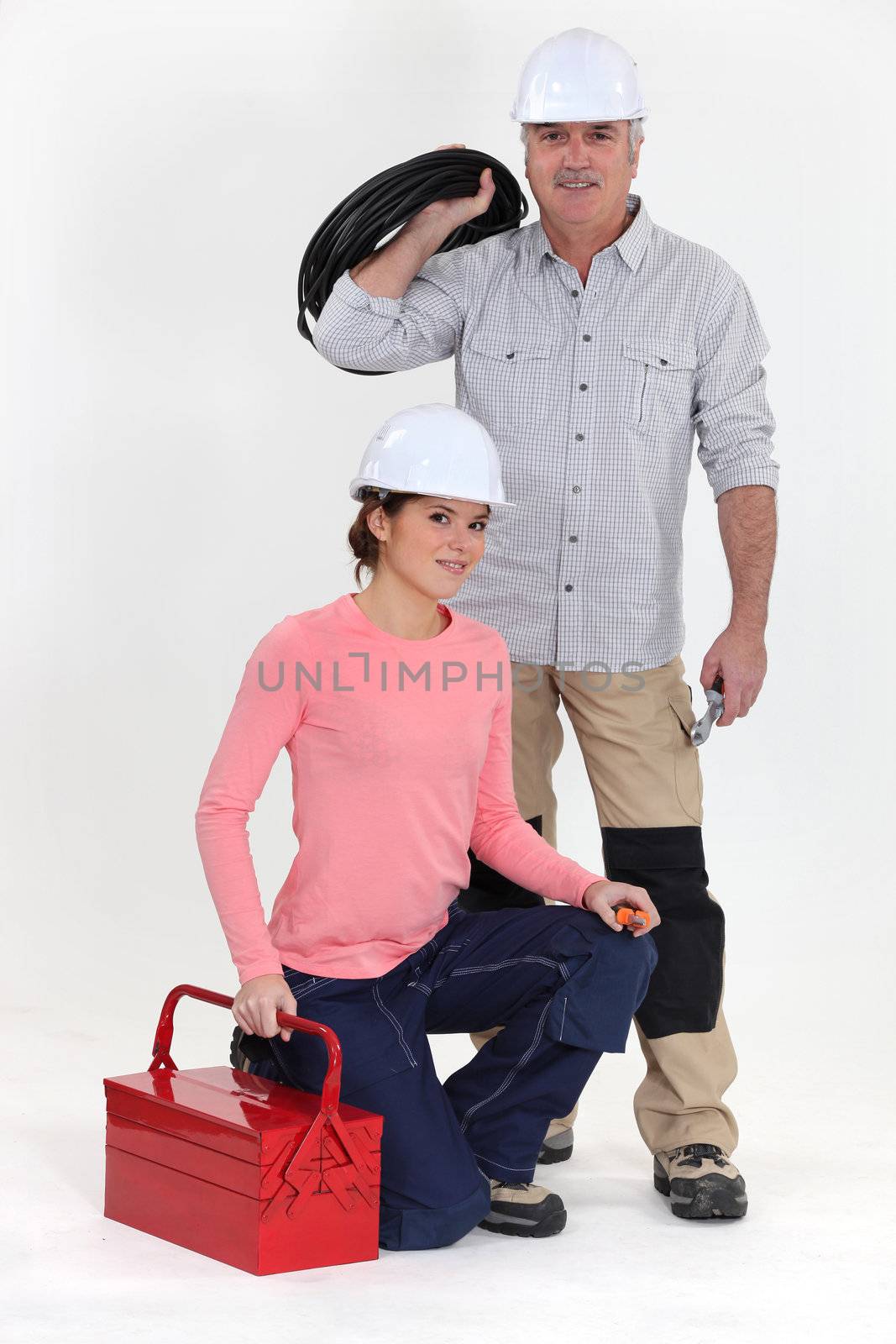 An electrician and his apprentice. by phovoir