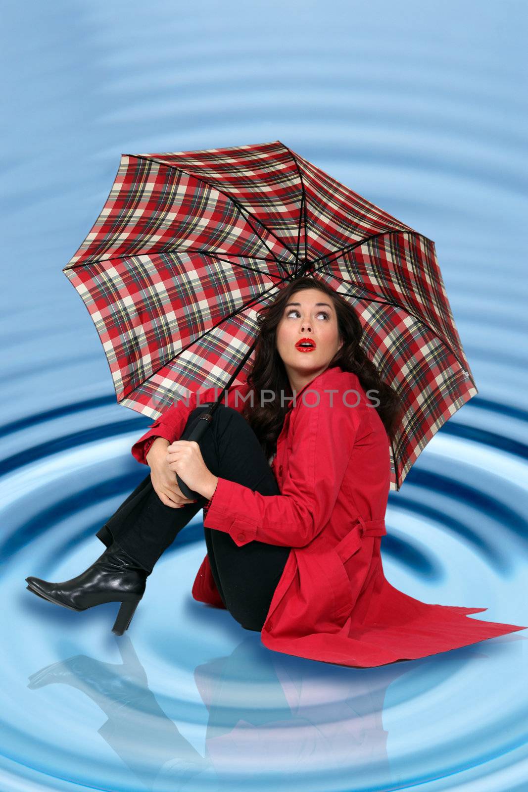 beautiful young woman under her umbrella