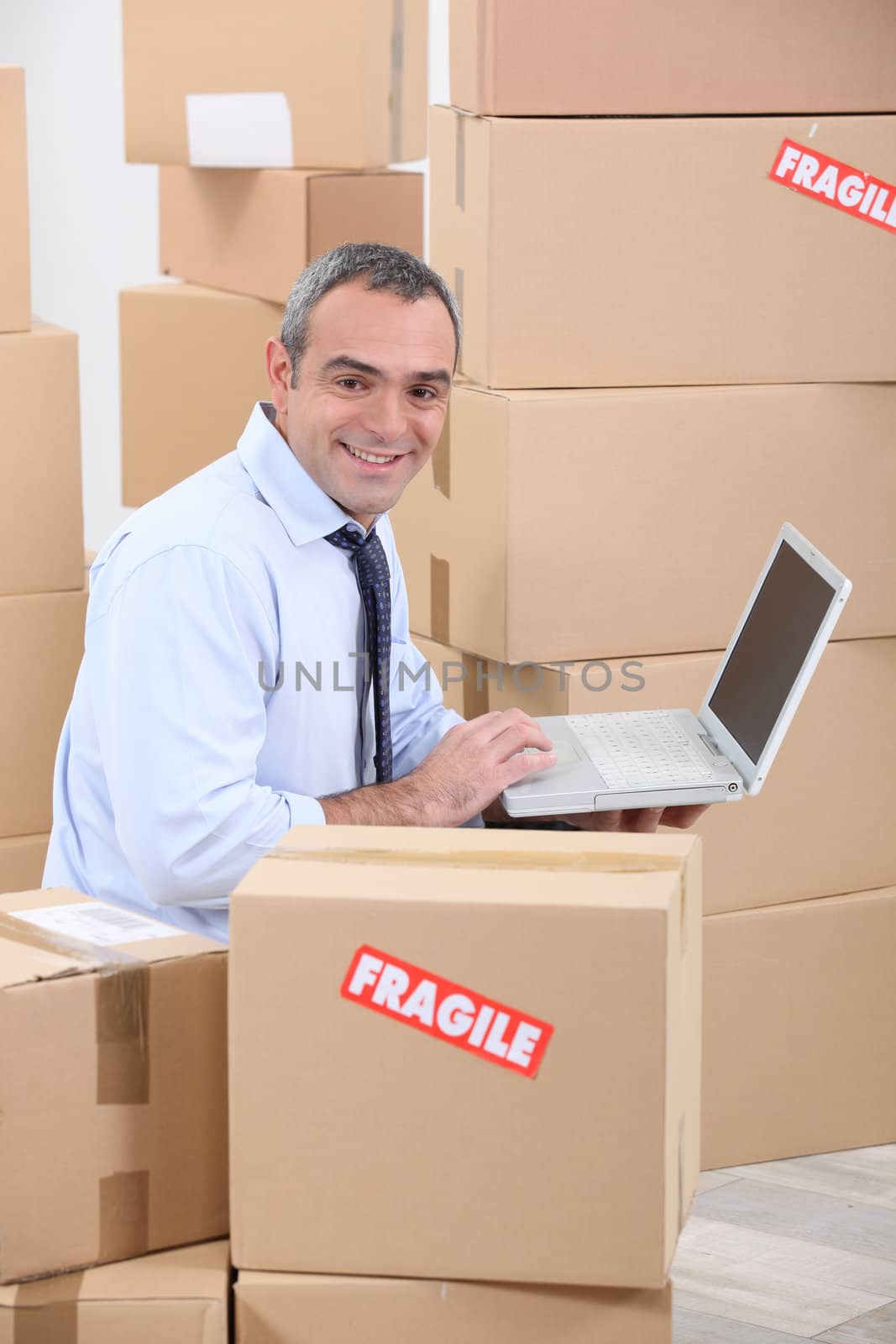 portrait of a man with cardboard boxes