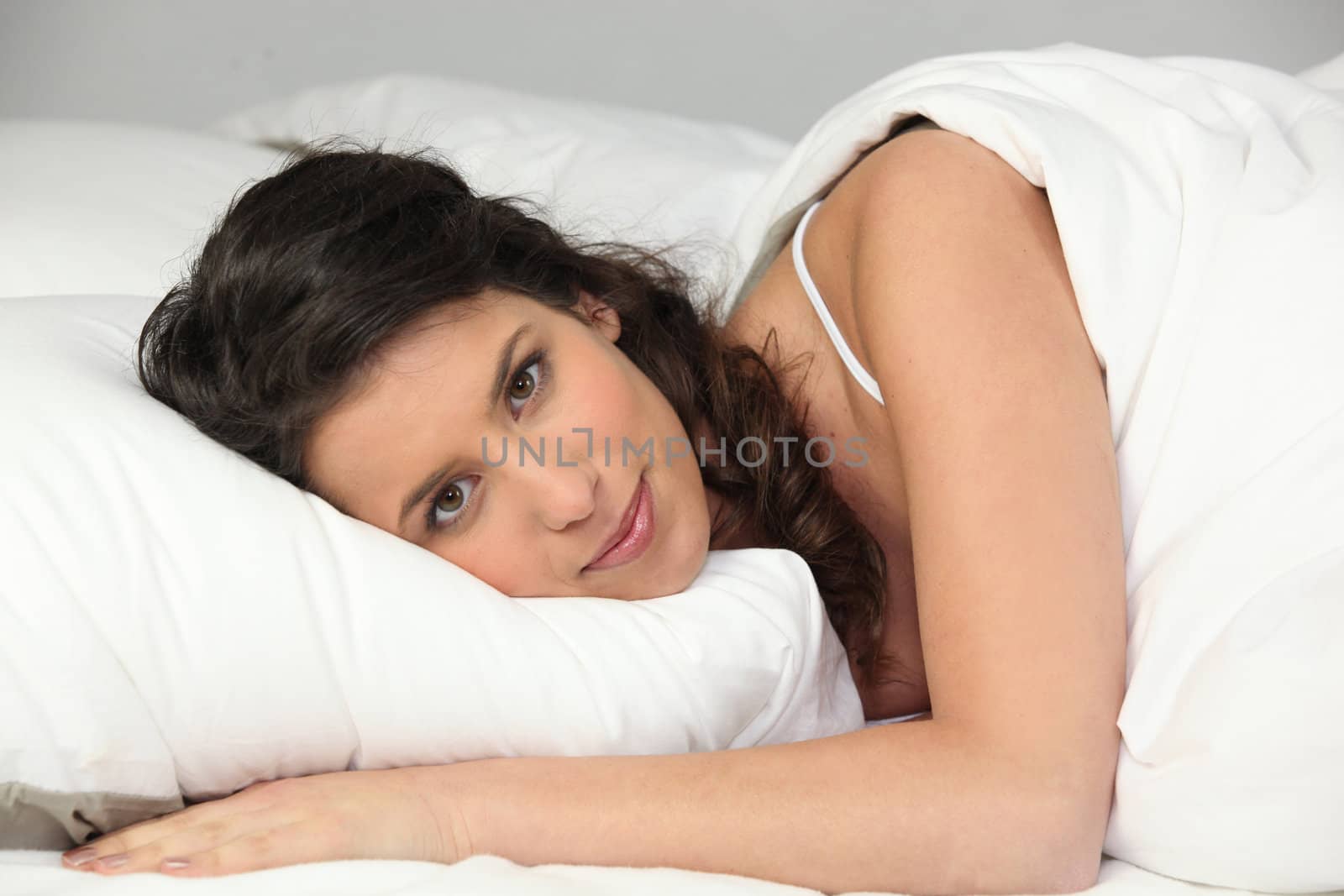 Woman waking up in bed