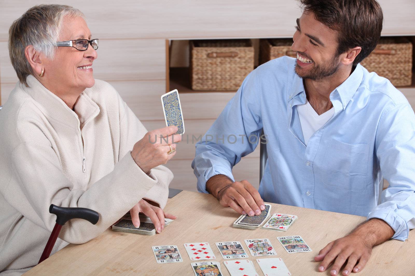 Mother and son playing cards