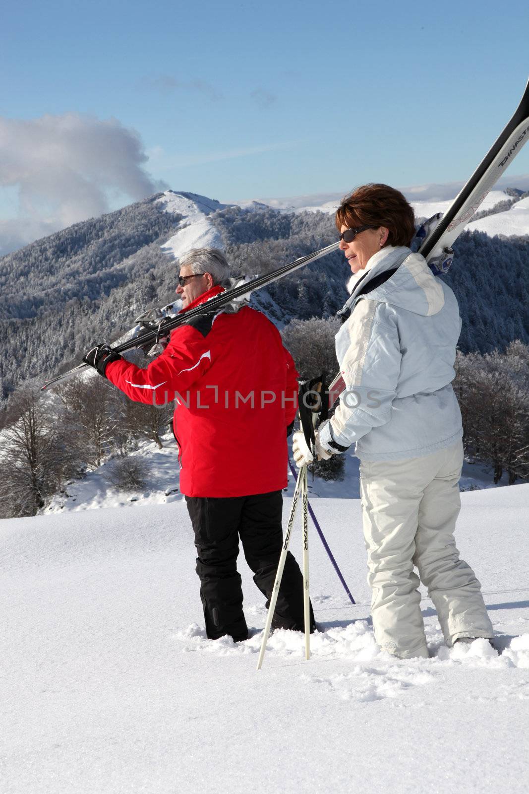 Older ski couple by phovoir