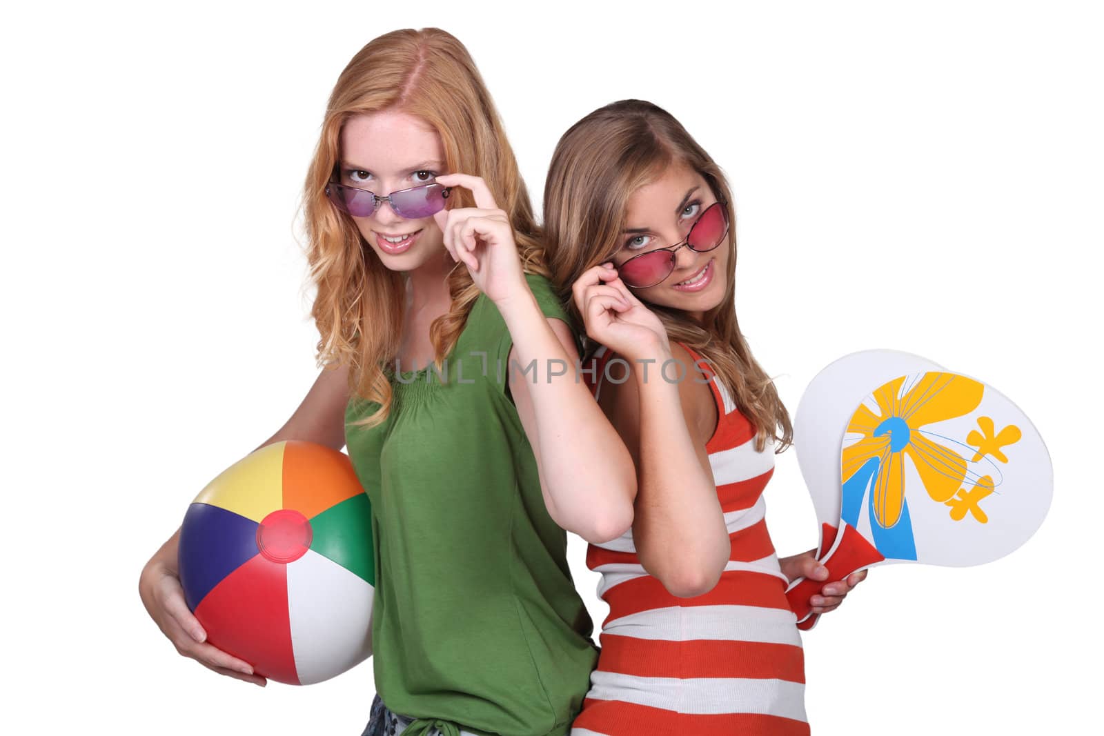 Studio shot of teenage girls with beachballs