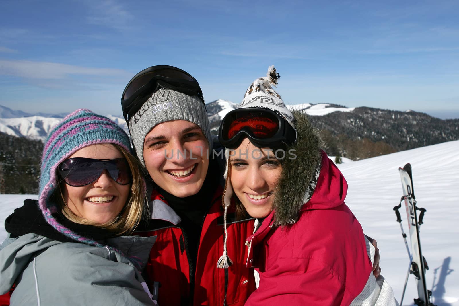 group of friends on a ski vacation by phovoir