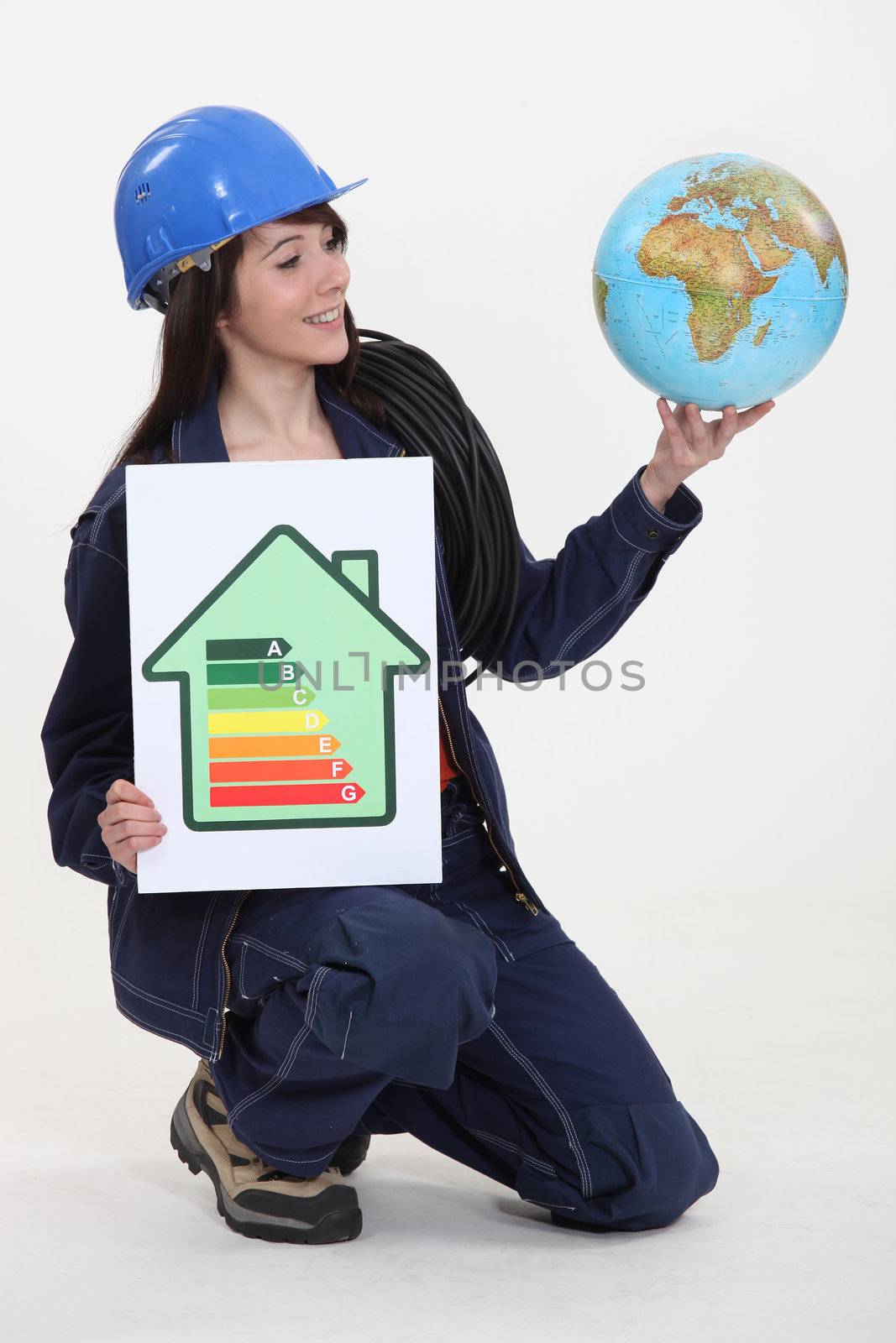 A female electrician promoting energy savings.
