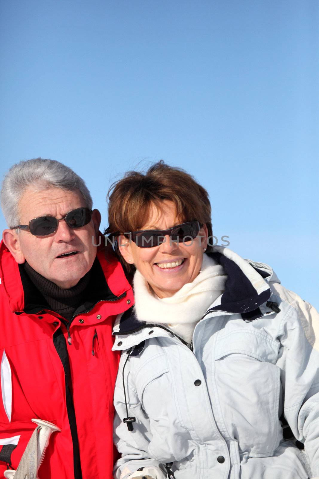 Adult couple skiing