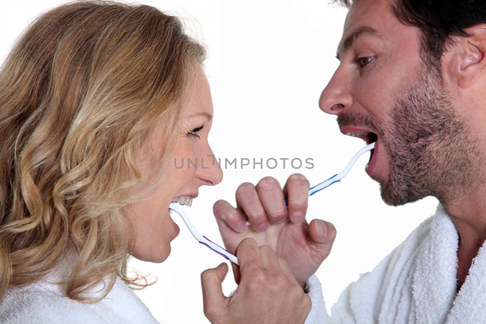 Couple brushing teeth