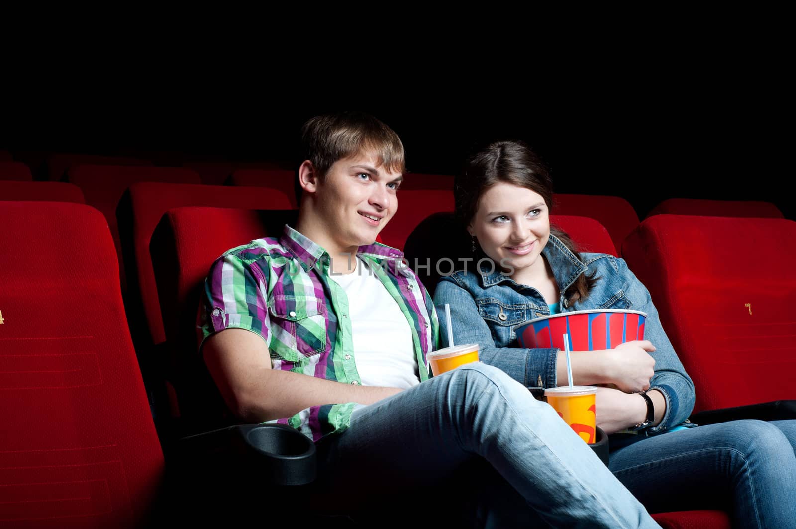 couple in a movie theater, watching a movie