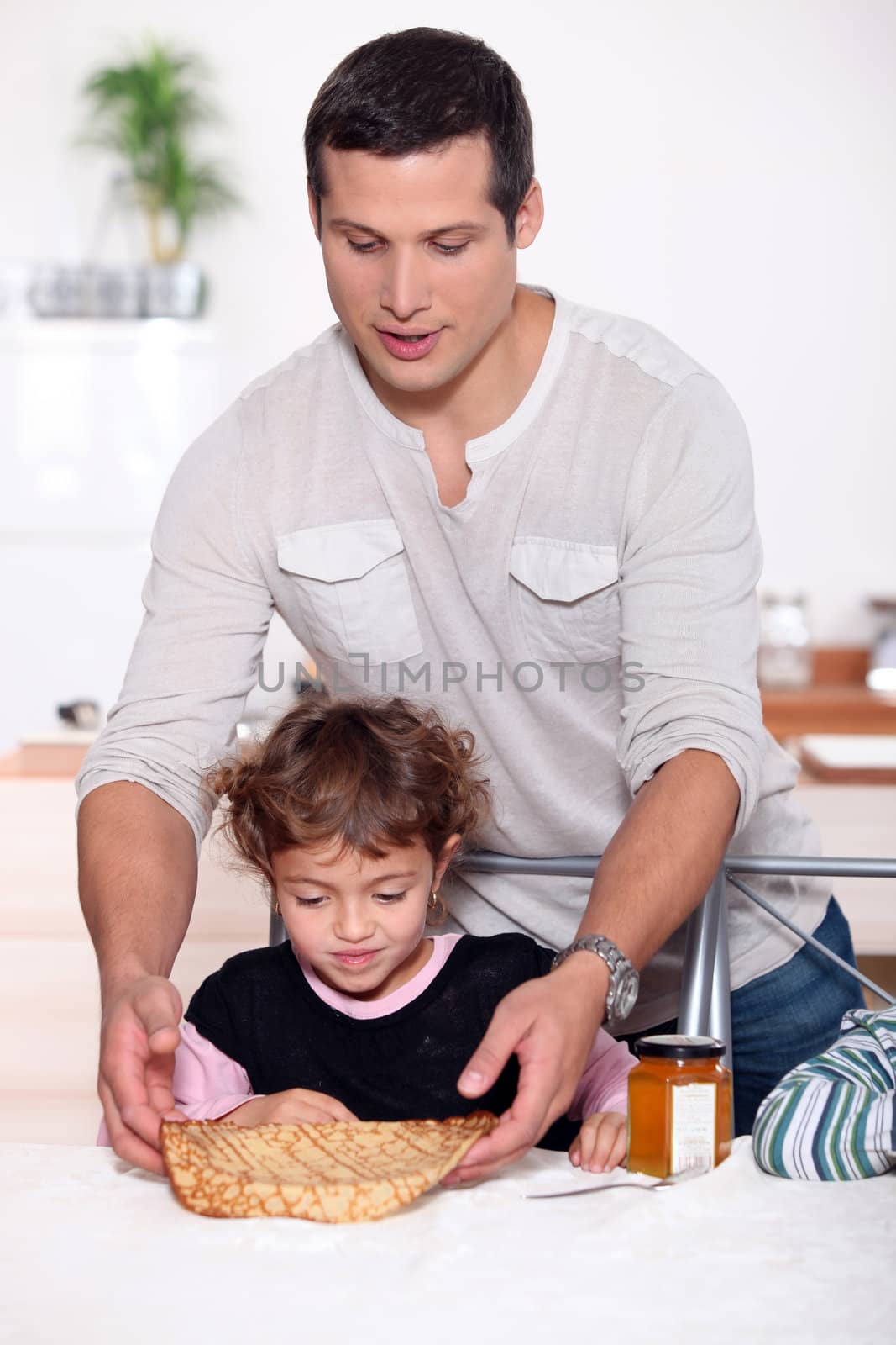 Girl being served a crepe