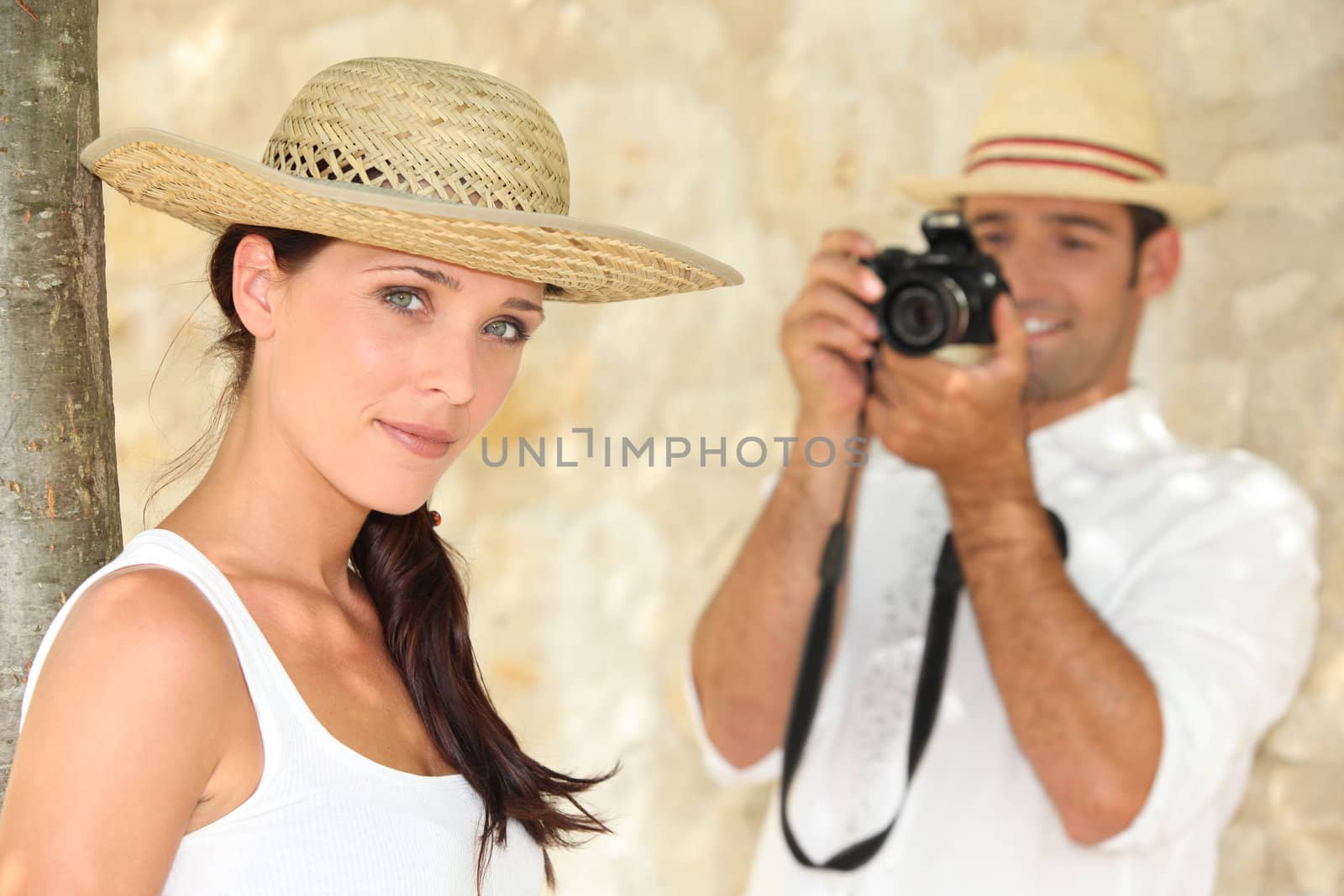 Man taking photograph of girlfriend