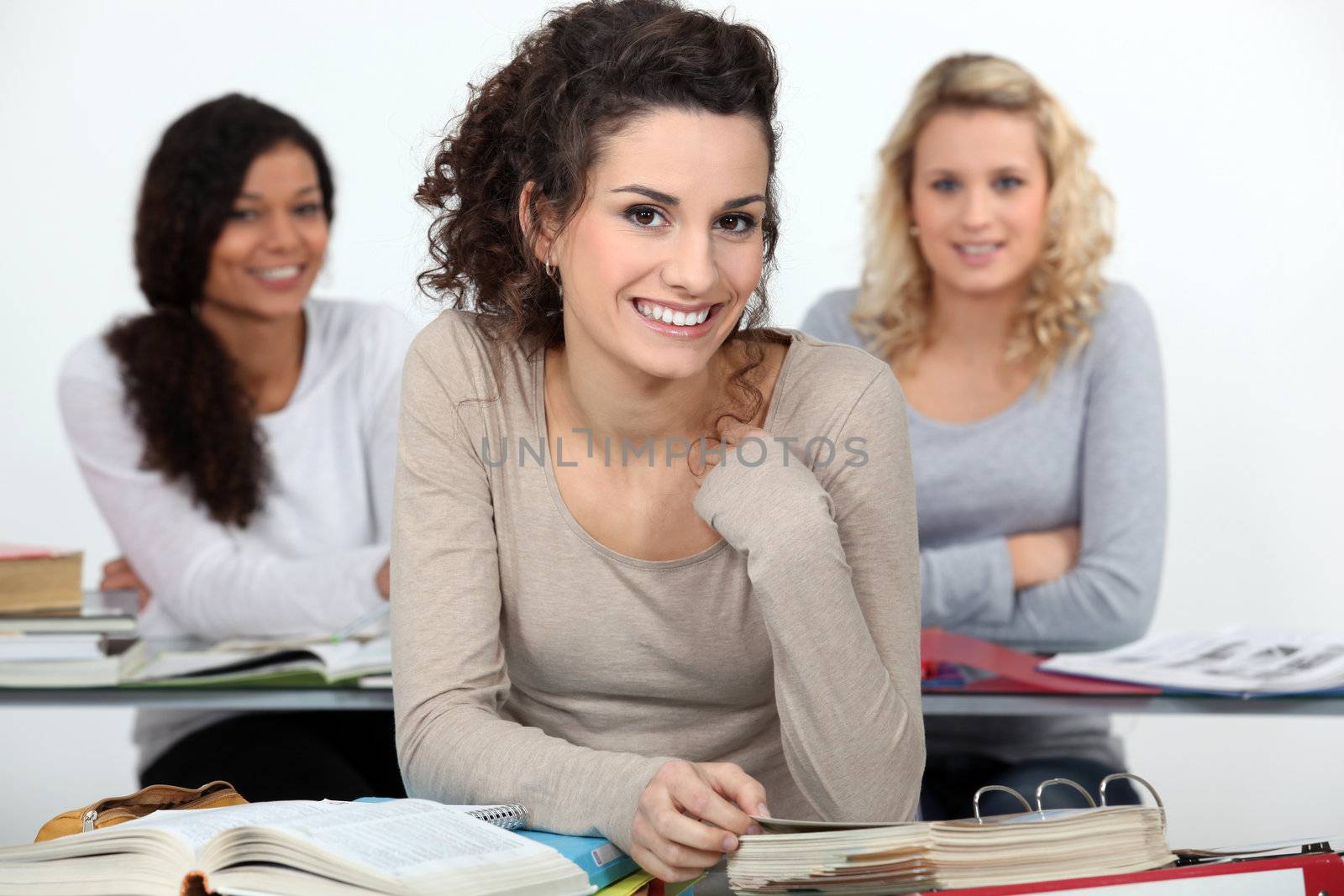 University students at desks by phovoir